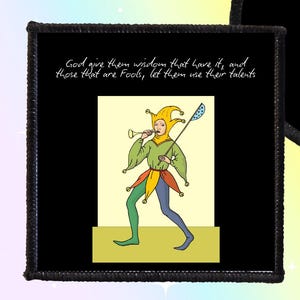 May include: Black iron-on or sew-on patch with a jester illustration in green, yellow, and blue. Available in square or circle shapes. The patch features the text, "God give them wisdom that have it, and those that are fools, let them use their talents."