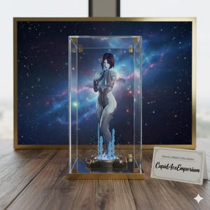 May include: A figure of a woman in a clear display case with a gold frame. The figure is light blue and white, with a short red hairstyle. The background is a galaxy scene. A small card reads "Handcrafted Collectibles CupidAceEmporium."