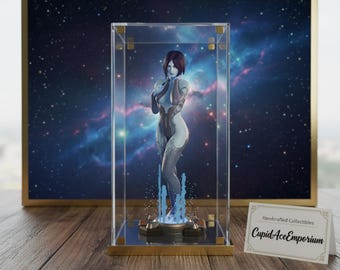 May include: A figure of a woman in a clear display case with a gold frame. The figure is light blue and white, with a short red hairstyle. The background is a galaxy scene. A small card reads "Handcrafted Collectibles CupidAceEmporium."