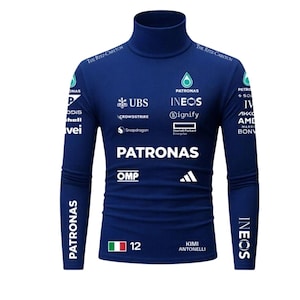 May include: A dark blue long-sleeve turtleneck shirt featuring various white sponsor logos including Petronas, Ineos, UBS, and the Adidas logo. The front displays the text Kimi Antonelli, the number 12, and an Italian flag graphic on the lower left side.