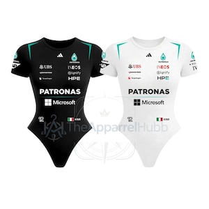 May include: Two short-sleeved bodysuits, one black and one white, featuring the Petronas Mercedes F1 team branding, sponsor logos including Microsoft, UBS, and Ineos, the number 12, and the name Kimi with an Italian flag icon on the lower front.