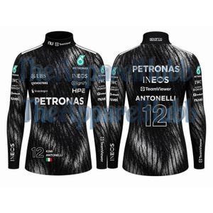 May include: Black long-sleeved shirt with a high collar, featuring the Petronas logo and sponsor branding. The shirt has a textured pattern and the number 12 on the front and back. The name ANTONELLI is printed on the back.