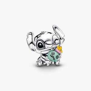 May include: A silver-colored charm featuring the character Stitch from Lilo & Stitch. Stitch is winking and holding a green and yellow charm. The charm is detailed with a cartoon-style design, perfect for Disney fans.