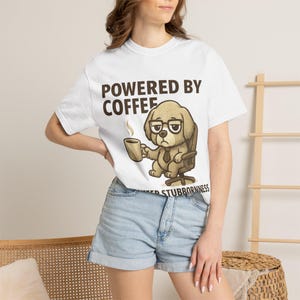 Powered By Coffee And Sheer Stubbornness T-shirt | Funny Grumpy Dog With Glasses, Office Humor Tee