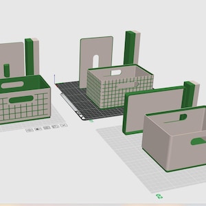 Może przedstawiać: Cyfrowy render 3D trzech prostokątnych skrzynek do przechowywania z wyciętymi uchwytami. Dwie skrzynki mają zielony wzór kratki na jasnoszarych powierzchniach, a trzecia jest jednolita, jasnoszara z zielonym wykończeniem na siatce.
