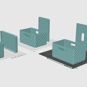 May include: Three teal storage bins with matching lids, displayed in a digital rendering. One bin has smooth sides, while the other two feature a textured, cross-hatched pattern. Each rectangular container includes integrated side handles.