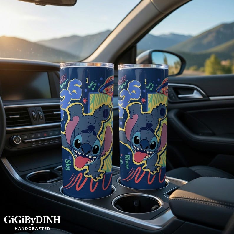 Two colorful tumblers with cartoon character designs are placed in the car's cup holder.