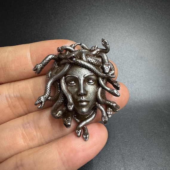 Retro-style snake woman statue/decoration for the light rail