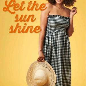 May include: A strapless, black and white gingham maxi dress with a ruffled neckline. A straw sun hat is held in the hand. The text "Let the sun shine" is in orange script on a yellow background.