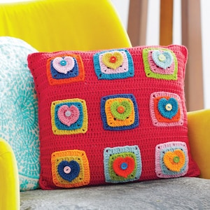 May include: A white ceramic mug with a black handle and the text "But First, Coffee" in a bold, black font. The mug is set against a blurred background, suggesting a cozy setting.