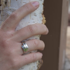 Hand made sterling silver ring that wraps around your finger like a hug. This ring has a hammered finish. Made to hold securely contain cremation ash, hair or fur.