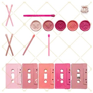 May include: A selection of pink and rose-toned items. Includes matches, wax seals with butterfly, bee, heart, and text designs, and cassette tapes. The items are arranged on a white background with a gold geometric pattern.