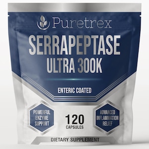 May include: A white and navy blue pouch of Puretrex Serrapeptase Ultra 300K dietary supplement. The pouch features the text "SERRAPEPTASE ULTRA 300K" in large, silver letters. It also states "120 CAPSULES" and "DIETARY SUPPLEMENT".