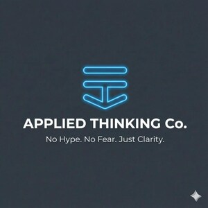 May include: A logo for Applied Thinking Co. features a blue neon outline of a stylized arrow pointing downward, above the company name in white text. Below, the tagline reads, "No Hype. No Fear. Just Clarity." The background is a dark gray.