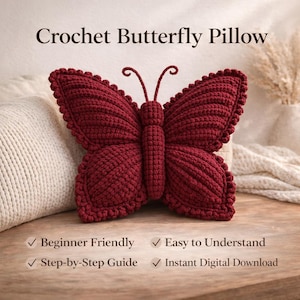 May include: A burgundy crochet butterfly pillow. The pillow is in the shape of a butterfly with detailed wings and antennae. The text "Crochet Butterfly Pillow" is at the top of the image. The image also includes the text "Beginner Friendly", "Easy to Understand", "Step-by-Step Guide", and "Instant Digital Download".