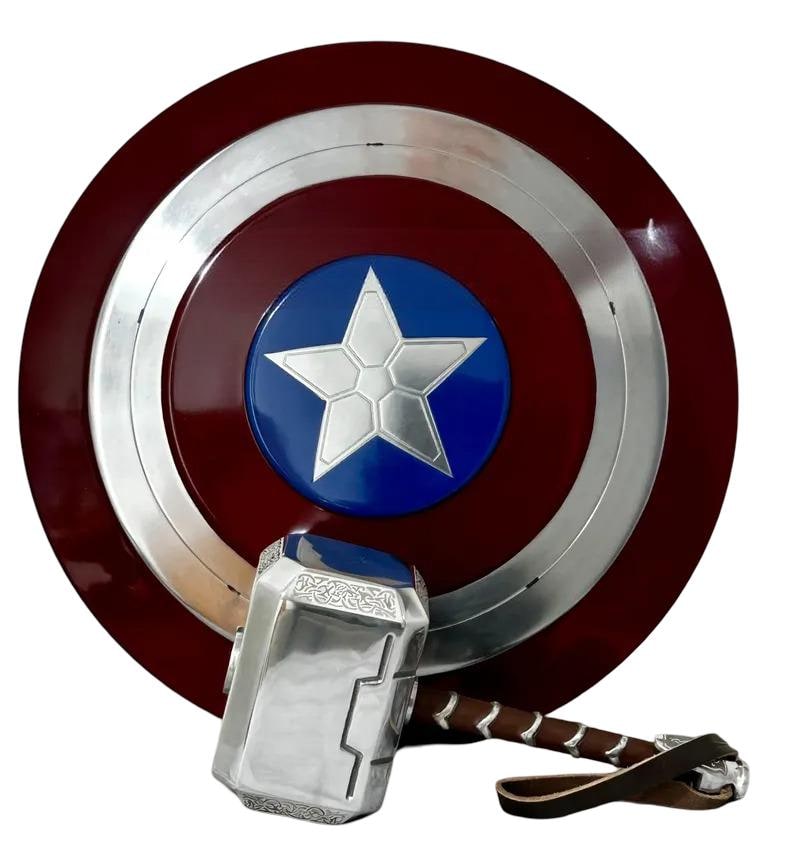 May include: A Captain America shield with a silver star on a blue circle, surrounded by a silver ring and a red background. A silver hammer with a brown leather strap rests below the shield.