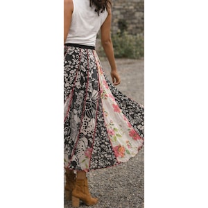 May include: A set of three ceramic mugs with a speckled, matte finish. The mugs are in shades of cream, light gray, and dark gray. Each mug has a simple, minimalist design, perfect for coffee or tea.