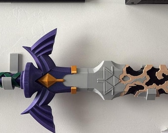 May include: A decorative sword with a purple, green, and gray handle, a silver blade, and a black tip with brown accents. The sword is mounted on a white wall, showcasing its intricate design and craftsmanship. The sword's hilt features a detailed, stylized design.
