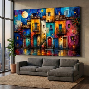 May include: A large rectangular wall art print depicting a vibrant street scene of colorful Mediterranean-style buildings at night. The painting features a bright full moon, glowing lanterns, and reflections on the ground in shades of blue, yellow, and red.