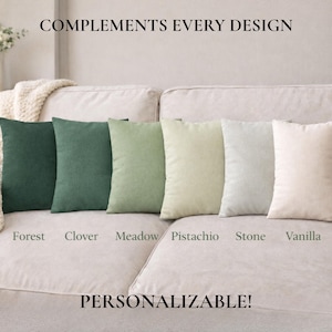 May include: Six rectangular throw pillows in shades of green and cream are arranged on a beige sofa. The pillows are labeled: Forest, Clover, Meadow, Pistachio, Stone, and Vanilla. The text "COMPLEMENTS EVERY DESIGN" and "PERSONALIZABLE!" are also visible.