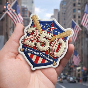 May include: Embroidered patch with a baseball theme, featuring the number "250" in a baseball stitch design, with the words "America Freedom". The patch has a shield shape with a red, white, and blue color scheme, and two crossed baseball bats.