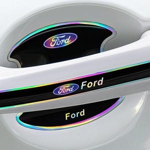 May include: A white car door handle featuring black protective decals with iridescent edges. The decals display the Ford logo and the word Ford in white text. The set includes a curved piece for the handle recess and a strip for the handle itself.