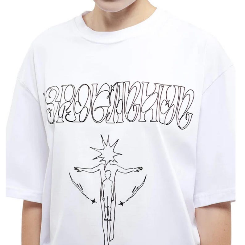 Loose Graphic Shirt | Oversized Short Sleeve Top | Daily Wear | Y2K Streetwear Style

Oversized graphic T-shirt with front and back prints, loose fit design, and Y2K streetwear style for casual everyday wear.