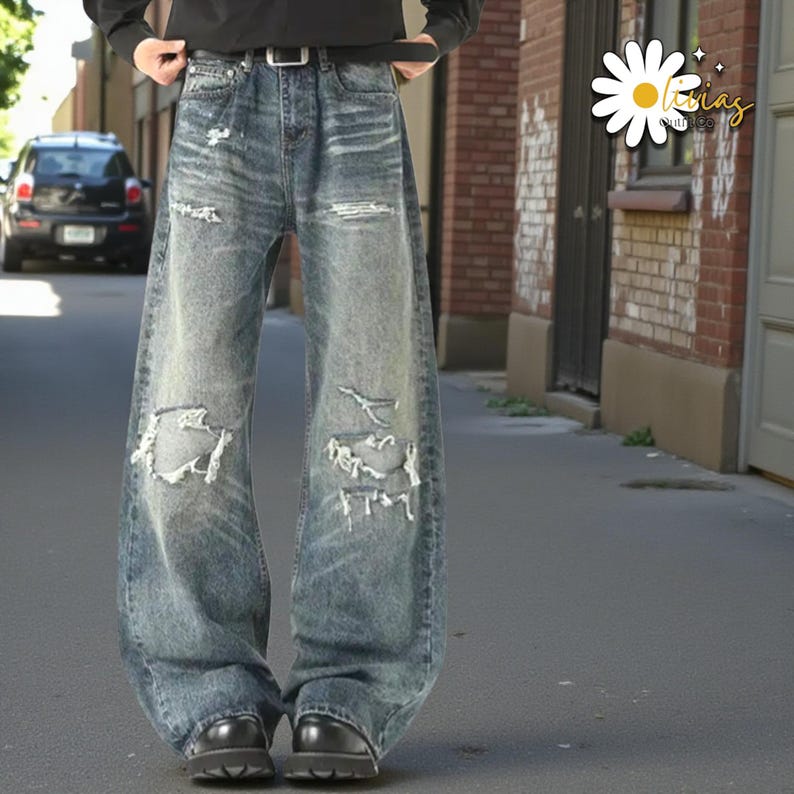 Distressed Washed Denim Jeans | Casual Wide Leg Pants | Grunge Y2K Streetwear

Distressed washed wide leg denim jeans with patch detailing styled for modern streetwear look.