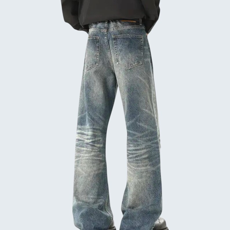 Distressed Washed Denim Jeans | Casual Wide Leg Pants | Grunge Y2K Streetwear

Distressed washed wide leg denim jeans with patch detailing styled for modern streetwear look.