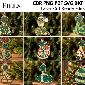 May include: A collection of 10 laser-cut wooden snake ornaments featuring various holiday themes including Santa hats, scarves, gifts, and a 2025 design. Each ornament is rendered in shades of green and brown with red hanging ribbons for display.