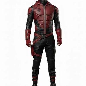 May include: A full-body costume featuring a dark red and black hooded jacket with a front zip and a stylised logo on the chest. The outfit includes matching black trousers, red forearm guards, a utility belt with a holster, and black boots.