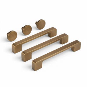 May include: A set of bronze-colored cabinet hardware, including three rectangular bar pulls and four round knobs. The hardware is made of metal and has a matte finish. The pulls are approximately 6 inches long.