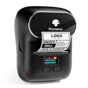 May include: A black label printer with a white and silver trim. The printer has a small screen and two buttons. A label is coming out of the printer with the words "LOGO DESIGN" and "UNISEX SMALL MADE IN INDONESIA".