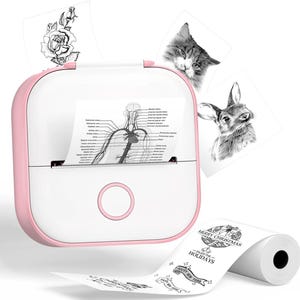 May include: A white and pink portable thermal printer with a roll of paper and several printed images. The images include a rose, a cat, a deer, and a diagram of the human circulatory system. The paper roll has holiday greetings.