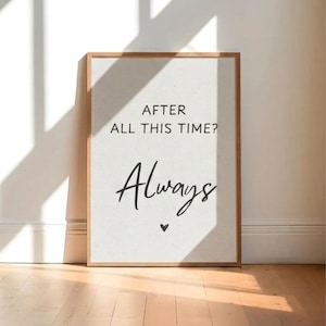 May include: A rectangular framed wall art piece featuring a light-colored background with the black text "AFTER ALL THIS TIME?" in a sans-serif font, followed by the word "Always" in a cursive script and a small black heart symbol below.