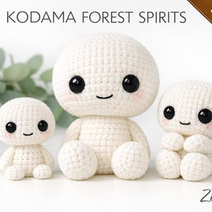 May include: Three crocheted Kodama Forest Spirits dolls in varying sizes. The dolls are white with black eyes and rosy cheeks. The image includes the text "Kodama Forest Spirits" and "3-in-1 Pattern Set". The dolls are handmade.