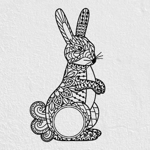 May include: Black and white decorative rabbit silhouette with intricate patterns. The rabbit is standing upright, featuring detailed designs on its body, ears, and tail. A circular space is present on the lower body, possibly for personalization or a monogram.