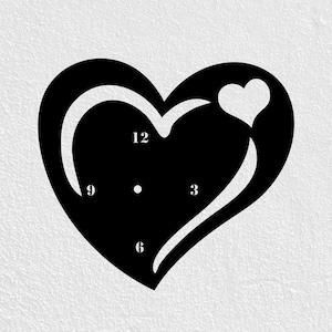 May include: Black heart-shaped wall clock with a smaller heart cutout. The clock face features the numbers 3, 6, 9, and 12. The clock is a decorative item for a home or office.