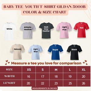 May include: Color and size chart for Gildan 5000B baby and youth t-shirts. The chart displays various colors: white, athletic heather, dark grey heather, light pink, red, natural, light blue, royal, and black. Measurements are in inches, with sizes ranging from XS to XL.