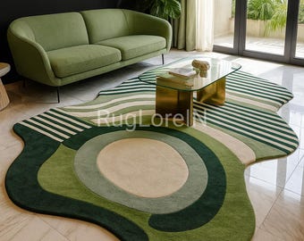 May include: A green and white patterned area rug with an organic shape. The rug features concentric circles and stripes in shades of green and cream, creating a modern, abstract design. The rug is placed in a living room setting.