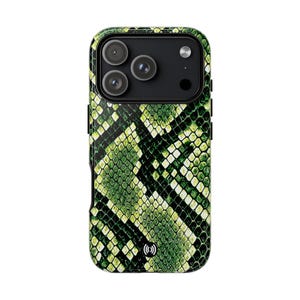 May include: A green and black snakeskin-patterned phone case. The case features a wireless charging symbol and a black camera module with three lenses. The case is designed to protect the phone from scratches and damage.