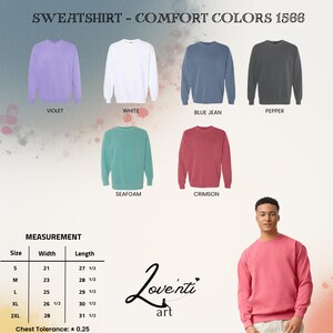 May include: A selection of Comfort Colors sweatshirts in various hues, including violet, white, blue jean, pepper, seafoam, and crimson. The image also displays a size chart with measurements in inches and a person wearing a crimson sweatshirt.