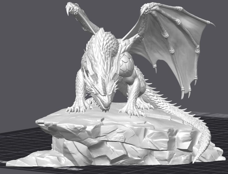 May include: A detailed, white dragon figurine with outstretched wings, perched atop a rocky base. The dragon has intricate scales, claws, and a long tail. The wings are spread wide, and the dragon appears to be looking down.