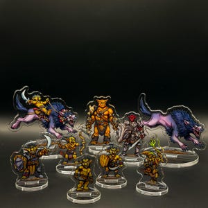 May include: A collection of fantasy character acrylic standees. The standees feature various creatures and warriors in vibrant colors, including goblins, a wolf, and a warrior in armor. Each standee is mounted on a clear base.