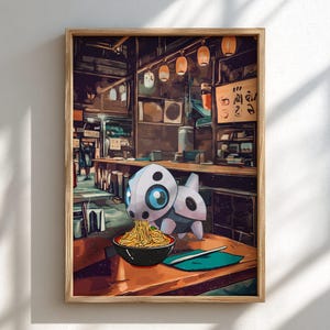 May include: A framed print featuring a cartoon creature with large blue eyes, eating ramen noodles in a black bowl. The artwork is set in a Japanese restaurant with hanging lanterns and wooden tables.