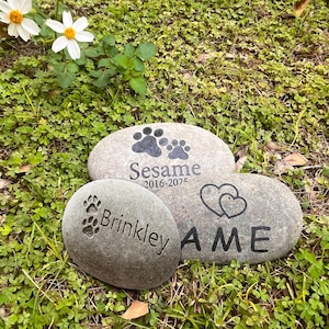 May include: A set of three ceramic mugs with a speckled, matte finish. The mugs are in shades of cream, light gray, and dark gray. Each mug has a simple, minimalist design, perfect for coffee or tea.