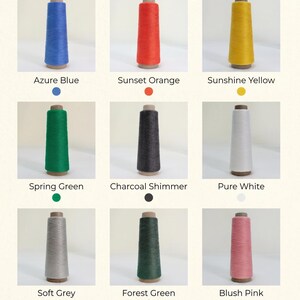 May include: A grid of nine conical spools of thread in various colors labeled Azure Blue, Sunset Orange, Sunshine Yellow, Spring Green, Charcoal Shimmer, Pure White, Soft Grey, Forest Green, and Blush Pink, each with a corresponding color dot.