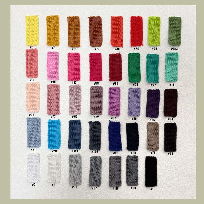 May include: A white ceramic mug with a black handle and the text "But First, Coffee" in a bold, black font. The mug is set against a blurred background, suggesting a cozy setting.