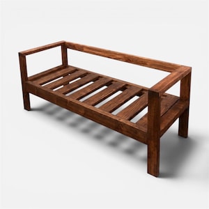 Puede incluir: Banco de madera marrón oscuro. Cuenta con un asiento de listones y un respaldo que se extiende para formar reposabrazos. El diseño es sencillo y rústico, adecuado para uso en interiores o exteriores. Mide unos 120 cm de largo.