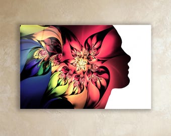 May include: A vibrant wall art print featuring a colorful floral design merging into a silhouette of a person's profile. The artwork showcases a spectrum of colors, including red, yellow, blue, and green, creating a striking visual contrast against a white background.